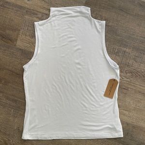 Super soft, thin, mock funnel neck shell.